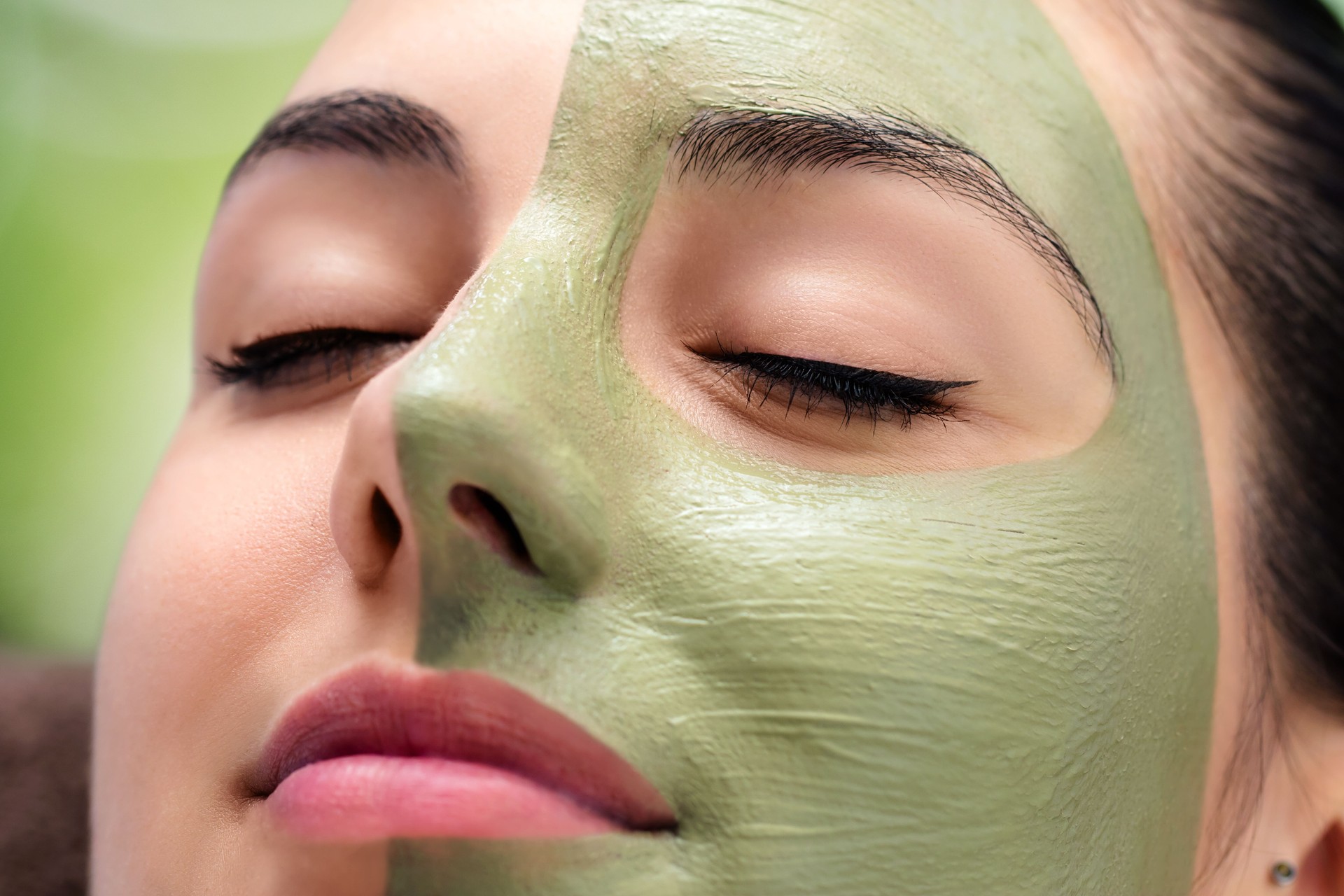 Facial beauty seaweed treatment on young woman.